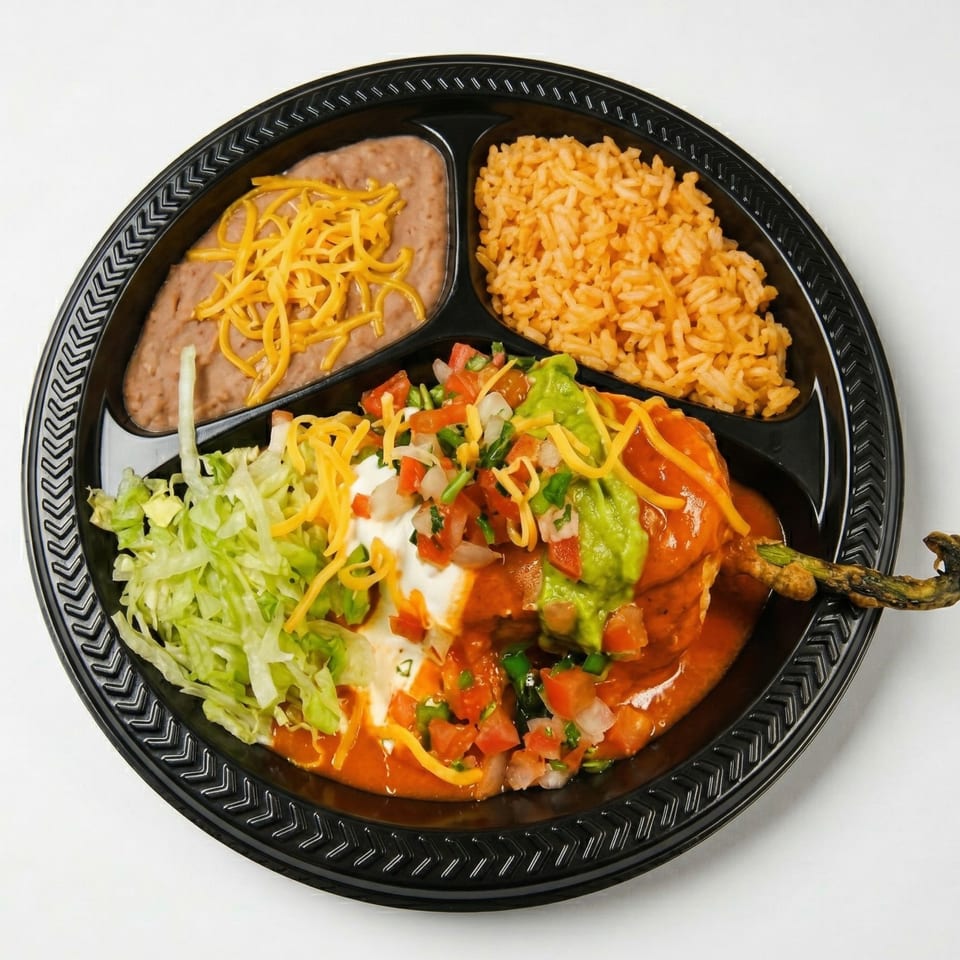 Chili Relleno with rice, refried beans, lettuce, sour cream, guacamole, and pico de gallo.