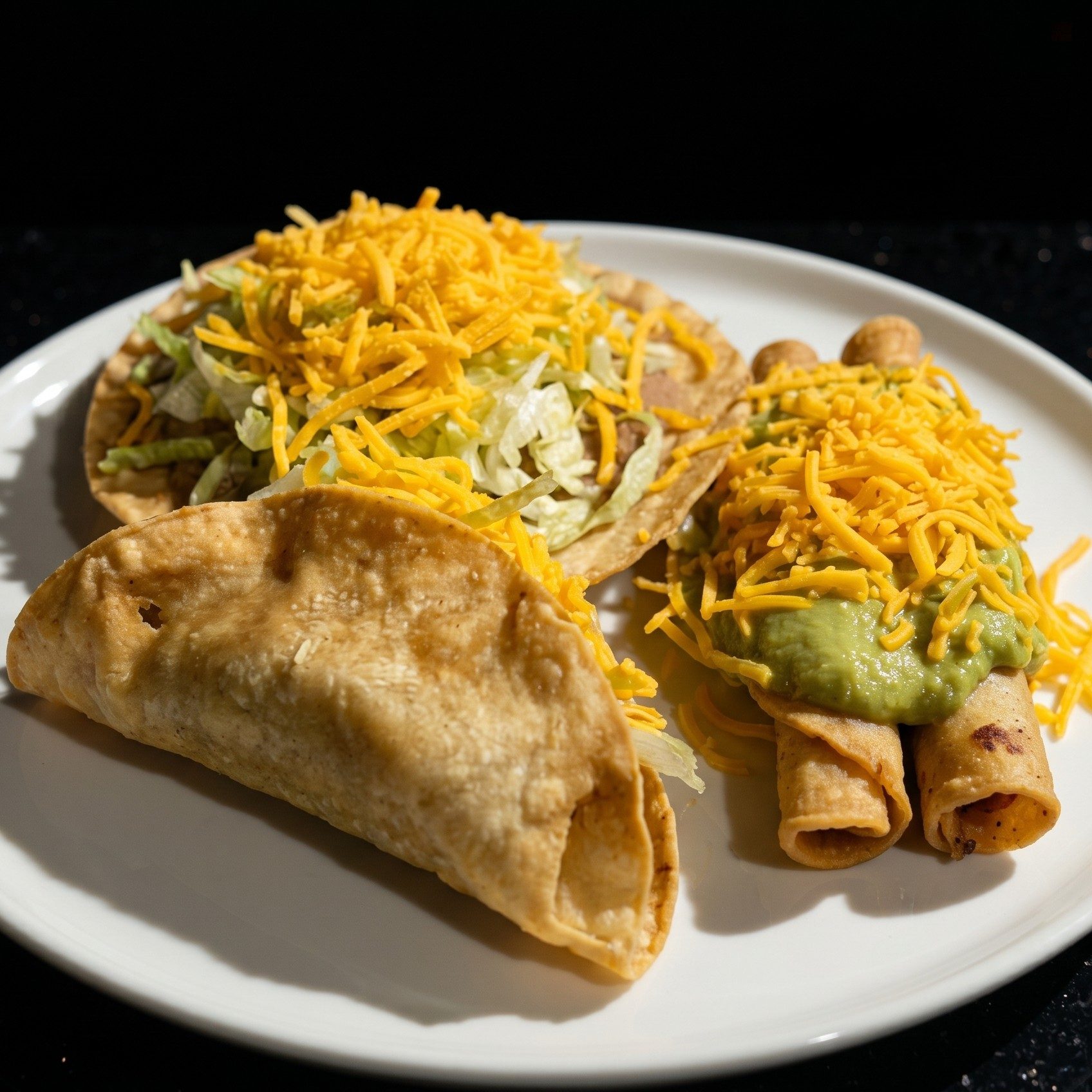 Bean Tostada, Beef Taco & 2 Roll Tacos Special.